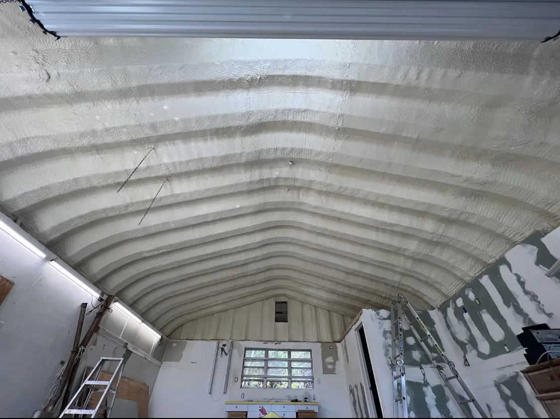 Spray polyurethane foam applied to the underside of a metal roof deck in Oildale